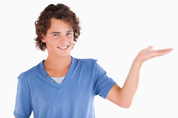 Close up of a cute guy showing copyspace