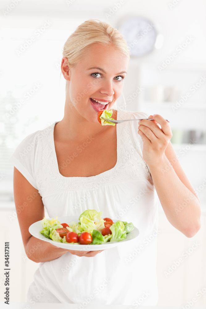 Poster woman eating a salad