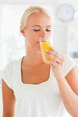 Portrait of a woman drinking juice