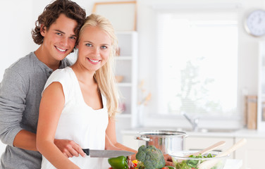 In love young couple cooking