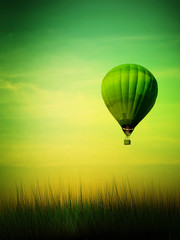Hot air balloon flying at sunrise