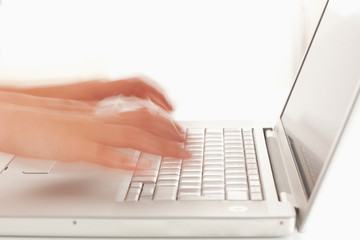 Slightly blurred hands on notebook