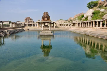  Ancient water pool and temple at Krishna market, Hampi, India © Noradoa