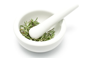 White ceramic mortar and pestle with rosemary