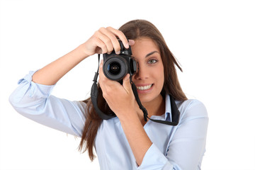 Portrait of woman using reflex digital camera