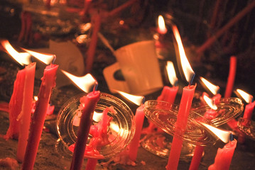 Light though red candles