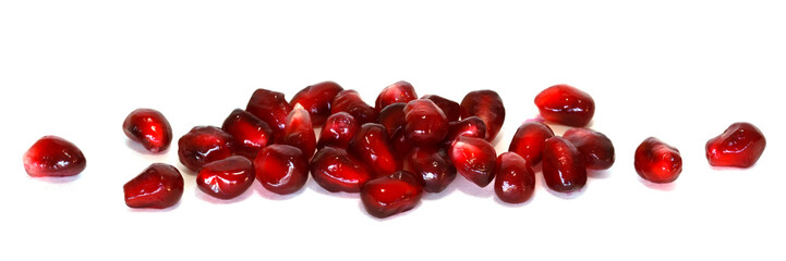 pomegranate seeds over white background