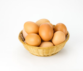 Brown eggs in wicker basket
