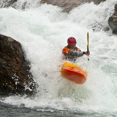 Kayaker in the waterfall