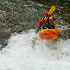 Kayaker in the waterfall