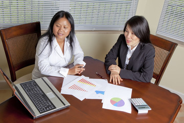 Asian business at desk working