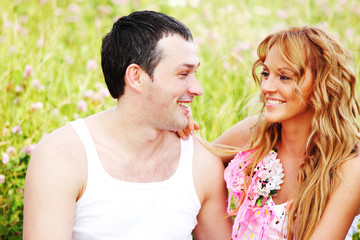 Fototapeta premium lovers on grass field