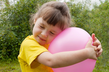 Baby girl and inflatable ball