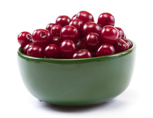 Bowl with ripe cherries. Isolated on a white background.