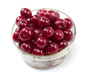 Bowl with ripe cherries. Isolated on a white background.
