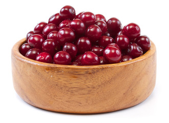 Bowl with ripe cherries. Isolated on a white background.