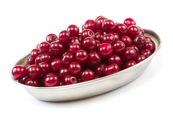 Bowl with ripe cherries. Isolated on a white background.