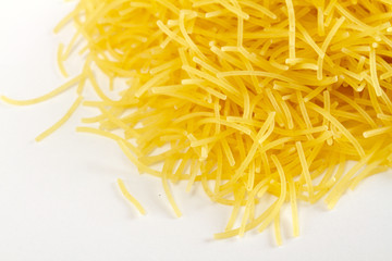 dried italian pasta on white background