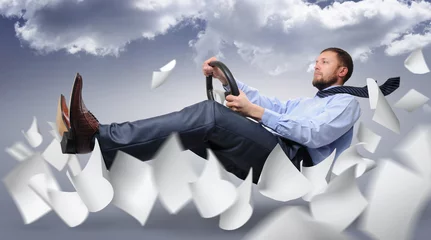 Fotobehang Snelle auto Business driver fly through the expanding white paper on clouds