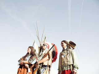 Group of North American Indians about a wigwam