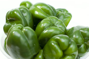 Obraz na płótnie Canvas Green fresh peppers on the white background