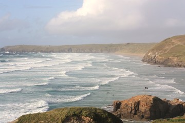 cornish beach with breakers surf and headlands