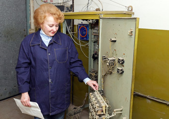 Woman engineer in machine room (elevator)