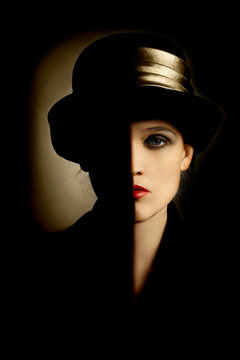 Woman fashion portrait in black hat