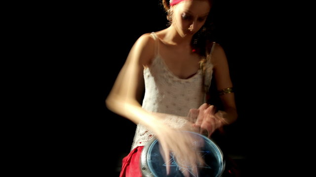 a female percussion drummer performing with bongos