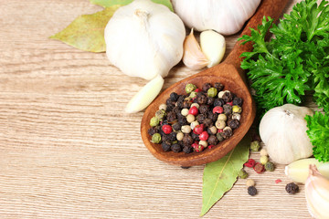 spices,  garlic and parsley on wooden background