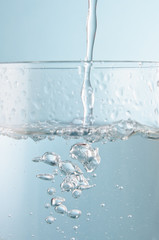 Pouring Water into Glass