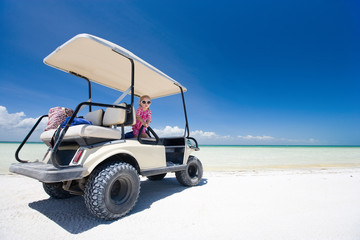 Golf cart at tropical beach © TravelPhotoBloggers