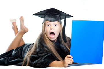 little girl in graduation dress with blue book on isolated white