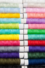 Fototapeta na wymiar Colored threads for sewing machine