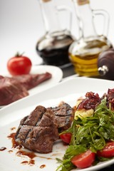 Beef steaks with vegetables