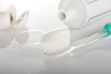 Fototapeta na wymiar Toothbrush, paste and dental floss