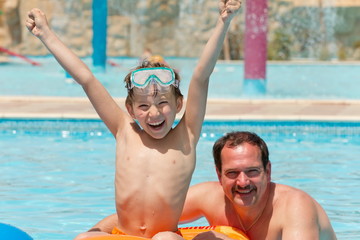 Father with son in pool