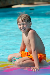 Happy boy in swimming pool