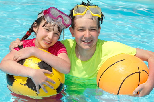 Happy young children in pool