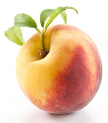 Ripe peach with leaves