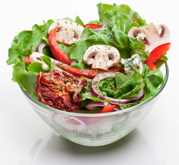 Salad with dried tomatoes, champignon and onion.