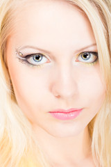Fototapeta premium Young beautiful blonde woman with make-up