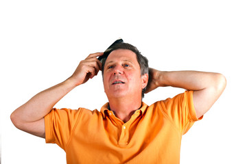 Naklejka premium attractive man combing his hair