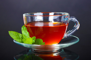 nice cup of tea and mint on black background