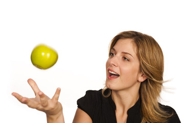 young woman holding green fruit over white background
