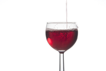 Pouring red wine.