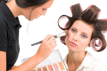 Make-up artist woman fashion model apply powder