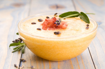fresh melon soup with parma ham and lavender flower