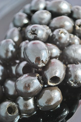Black olives on a black plate