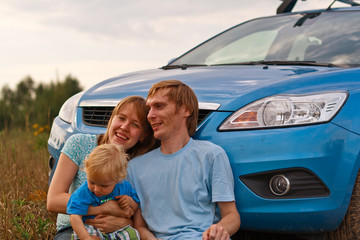 Young family travel by car
